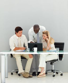 Young business people conversing in an office