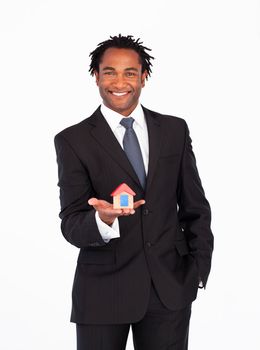 Afro-american businessman with house for real estate concept 