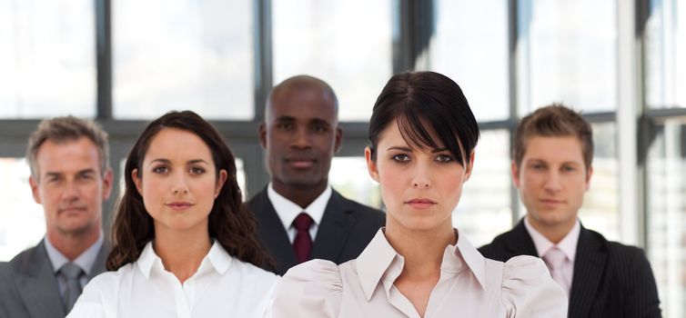 Charming business team standing together smiling at the camera 