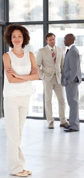 Portrait of a cute businesswoman with her team in the background