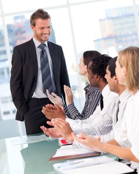 International business people clapping after a presentation