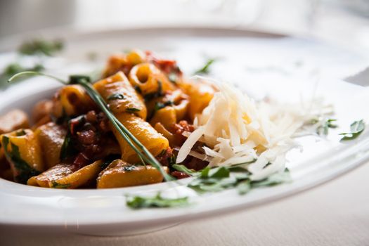 Italy, the best Florence restaurant. Example of Paccheri Pasta served at the table, no studio photo