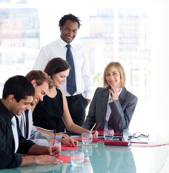 Afro-American Businessman training a group of students in business