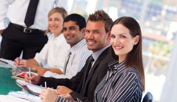 Smiling young business people in a meeting