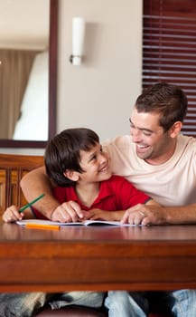 Handsome father helping his son for homework