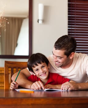 Delighted father helping his son for homework