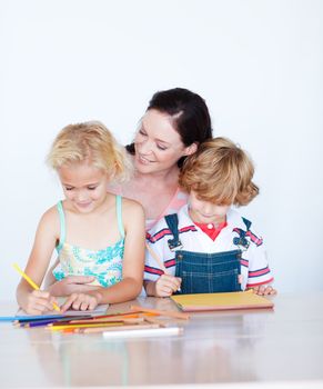 Mother painting with her children at home