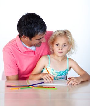 Beautiful daughter painting with her dad at home