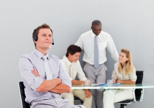 Businessman with a headset on in an office