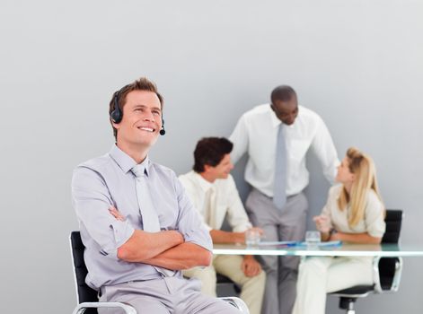 Businessman talking on a headset in an office