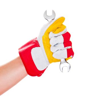 gloved hand with a wrench isolated on a white background