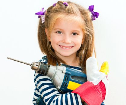 little smiling girl with a blue drill