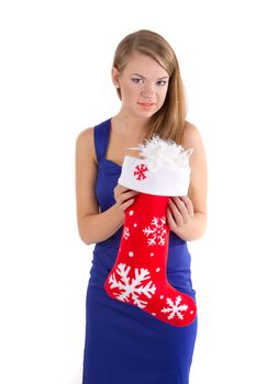 A girl in a blue dress with long hair holding a red Christmas sock