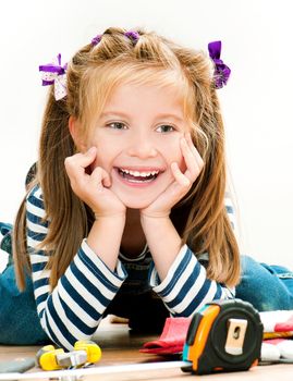 little smiling girl with tools