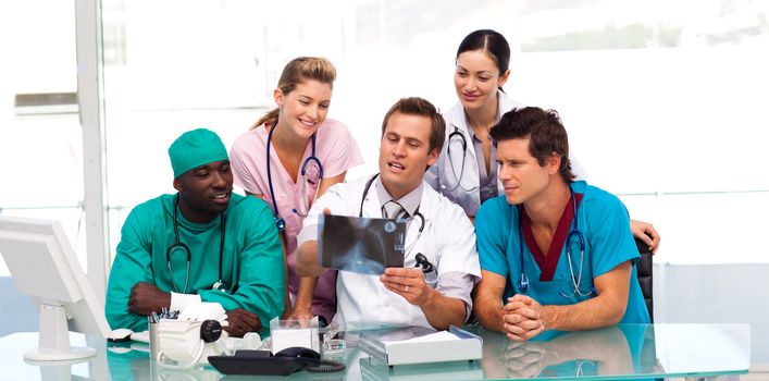 Group of doctors examining an X-ray in hospital