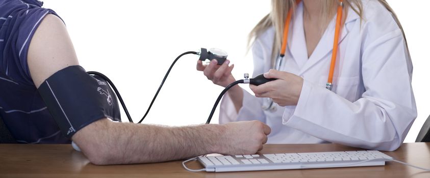 Doctor measuring blood pressure of a patient in clinic