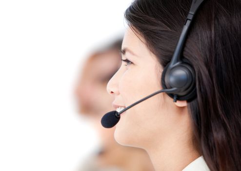 Close-up of business people with headset on standing against a white background