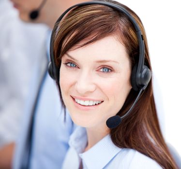 Portrait of caucasian businesswoman with headset on against white background