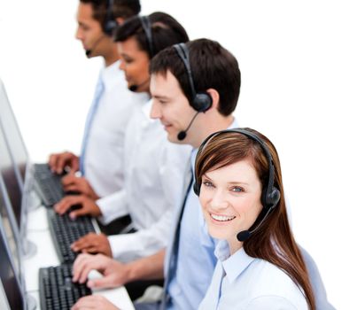 Concentrated business team with headset on  against white background