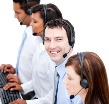 Portrait of smiling business team with  headset on against white background