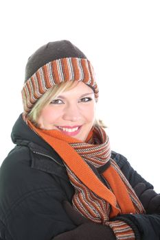Stylish smiling young woman in a warm woollen winter ensemble of coat, hat, gloves and scarf
