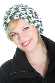 Beautiful vivacious woman with a beaming smile fullof vitality dressed for winter in a knitted cap and warm coat isolated on white Beautiful vivacious woman with a beaming smile fullof vitality dressed for winter in a knitted cap and warm coat oisolated on white