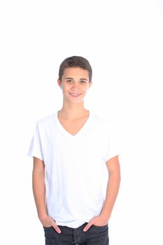 Smiling confident teenage boy dressed casually in jeans standing with his hands in his pockets isolated on white Smiling confident l teenage boy dressed casually in jeans standing with his hands in his pockets isolated on white