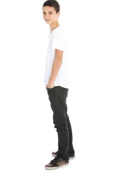 Full lenghth portrait of a relaxed modern good looking teenage boy in jeans, sneakers and a t-shirt isolated on white