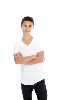 Casual young teenage boy standing smiling with his arms folded isolated on white