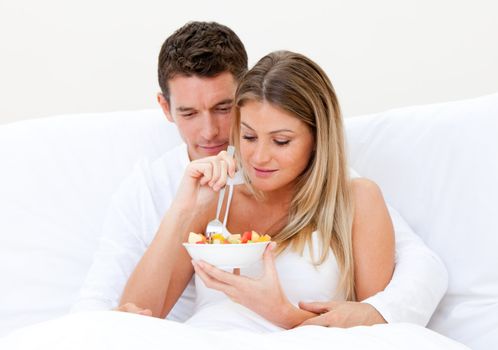 Caucasian couple having breakfast against a white background