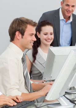 Young business people and manager working with computers in an office