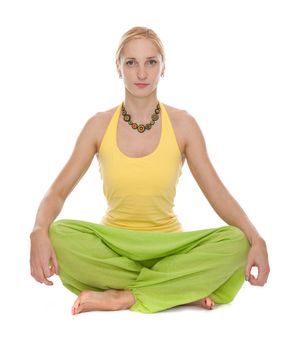 Practicing Yoga. Young woman isolated on white background