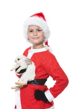 Boy holding a christmas rabbit isolated on white background