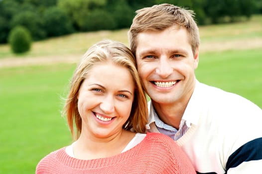 Cheerful closeup portrait of attractive young couple