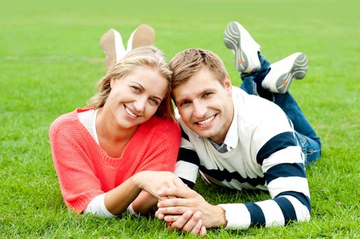 Couple outdoors enjoying the fresh air. Facing camera with a smile