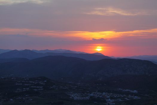 Summer landscape in mountains with the sun