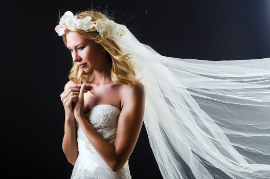 Bride in white dress in studio