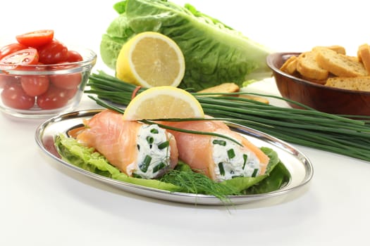 stuffed salmon rolls with cream cheese, chives and a lemon slice