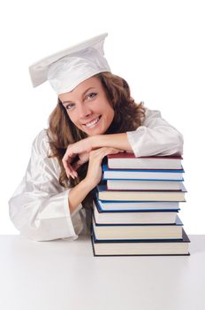 Happy graduate with lots of books on white