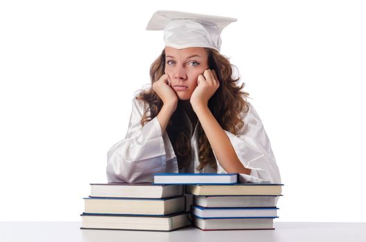 Happy graduate with lots of books on white