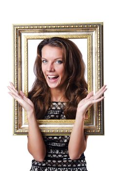 Young woman with picture frame on white