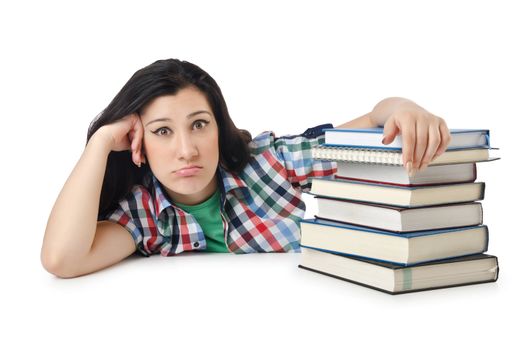 Tired student with textbooks on white