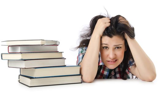 Tired student with textbooks on white