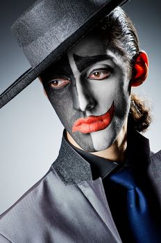 Businessman with clown face paint