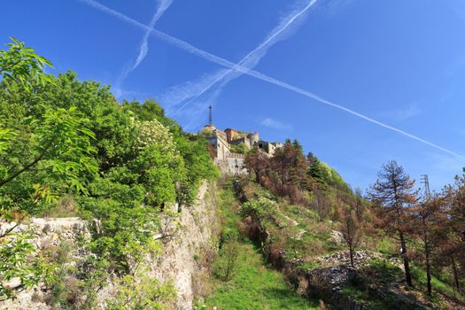 walls and moat of Sperone Castle, a medieval fortress built over Genova, Liguria, Italy