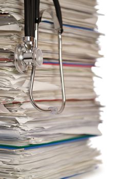 Stack of papers with stethoscope