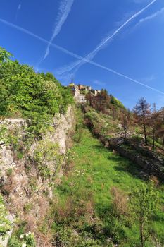walls and moat of Sperone Castle, a medieval fortress built over Genova, Liguria, Italy
