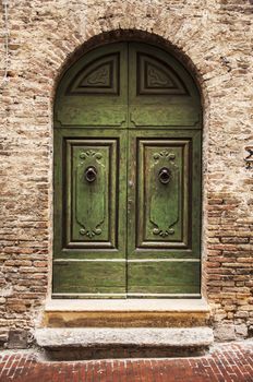 door of the old building in italian village of tuscany, italy
