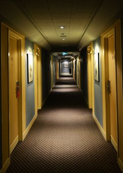 corridor in hotel with rooms entrances from both sides