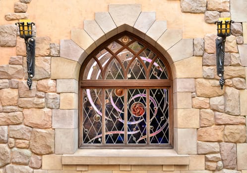 Arched window in a stone wall